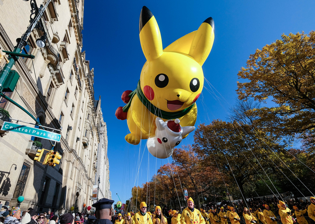 The Pikachu balloon floats down Central Park West on a bright and clear day.